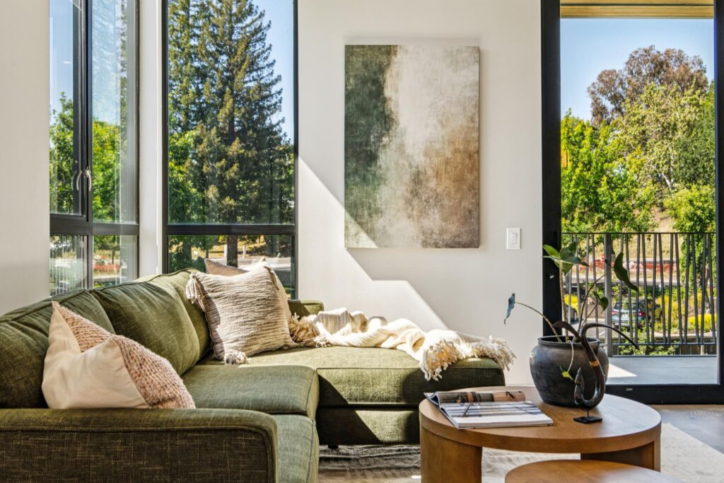 Sunlit Nova living room with white oak floors, the elevated comfort active adults gain when downsizing in Danville