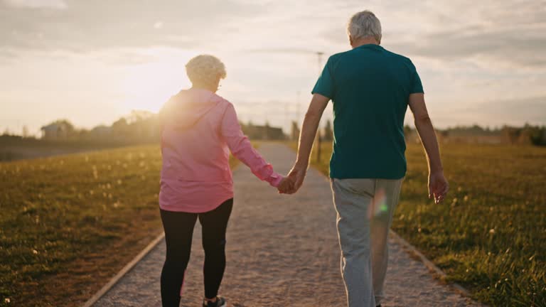 Active adults walking the Iron Horse Trail in Danville, staying fit after downsizing to The Nova